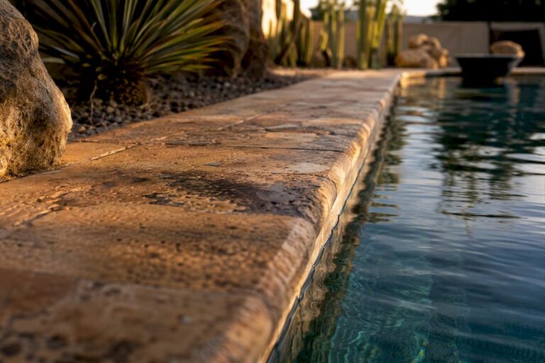 Stone pool coping edge in Arizona backyard